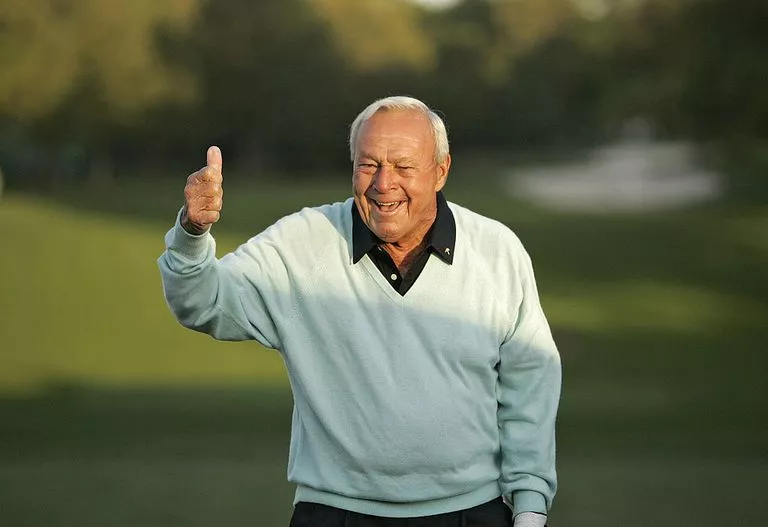 Arnold Palmer giving a thumbs-up sign