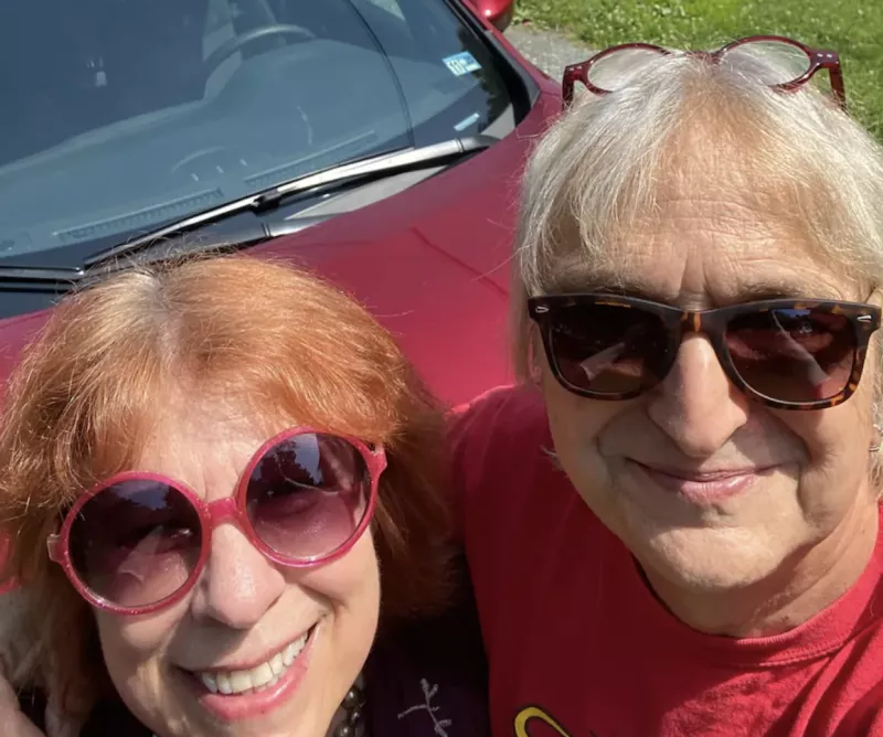 Heterosexual couple with sunglasses taking a selfie
