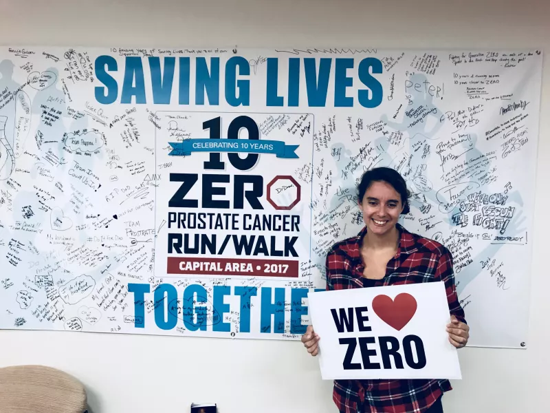 Amanda Singer holds a We Heart ZERO sign