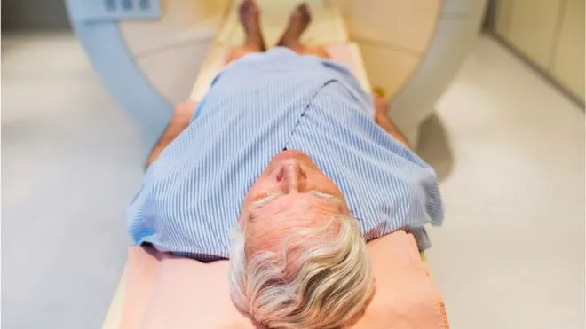 Middle-aged man undergoing radiation