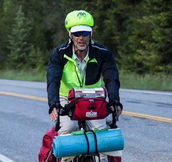 A man in sports gear cycling