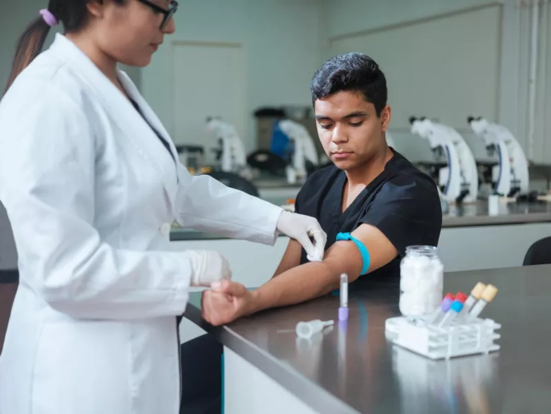 Nurse taking a man's blood test