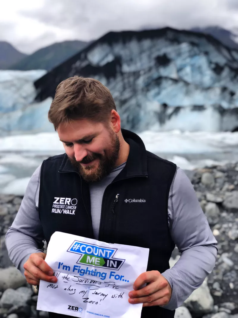 Man holding up a ZERO sign of reasons he fights for