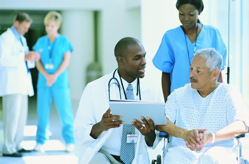 Depiction of medical team talking to a man