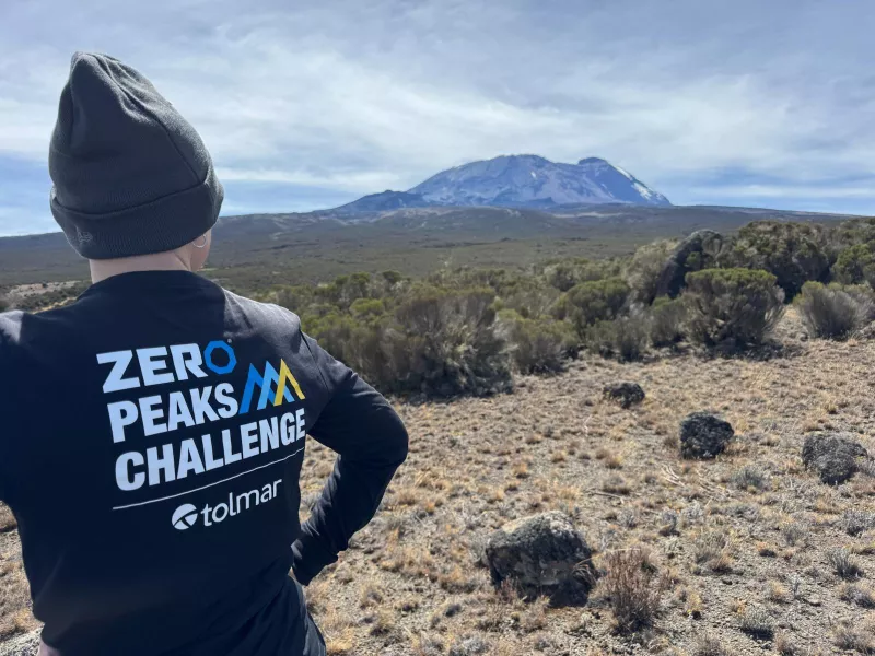 Peaks participant with logo shirt on Kilimanjaro