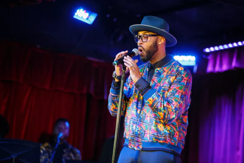Montell Jordan Performing with Blue Hat and Glasses