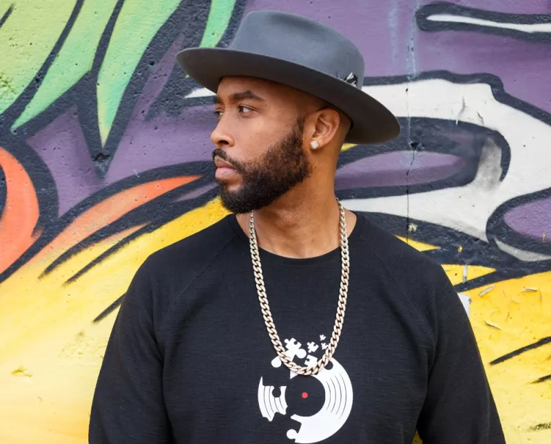 Montell Jordan Standing in Front of Mural