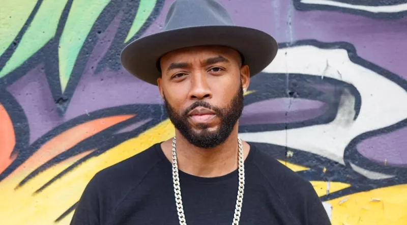 Montell Jordan Standing in Front of Mural