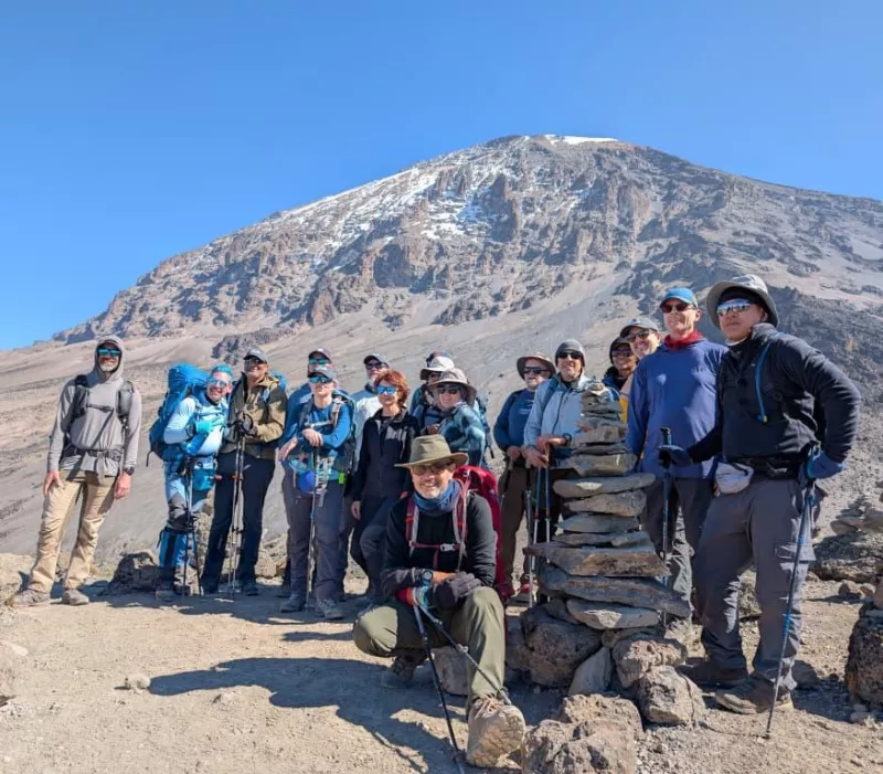 group by a big rock in Kilimanjaro