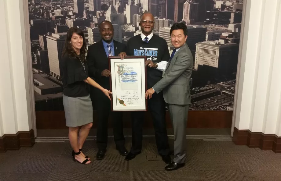 Elected Council Members display a formal proclaimation of committment to address prostate cancer