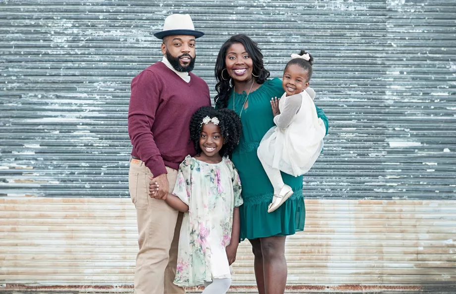 Prostate cancer survivor, Mical Roy, his wife, and two daughters