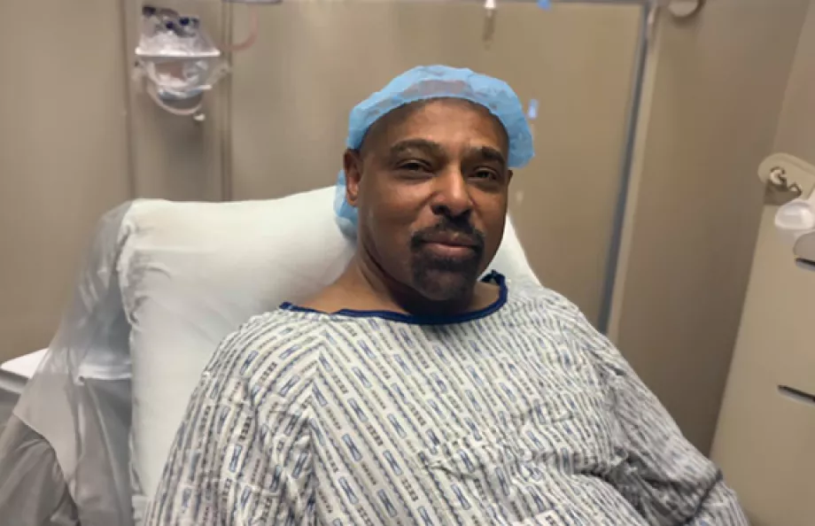 Dennis Stanley in a hospital bed