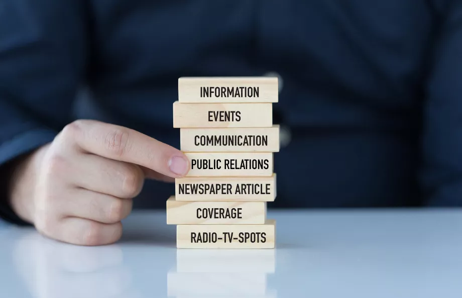 A stack of jenga with different media terms