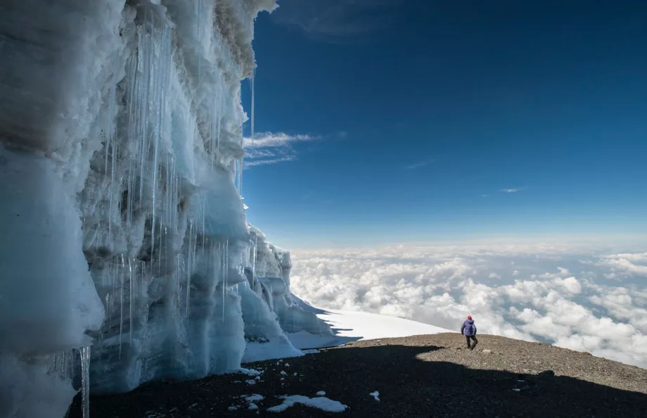 Icy mountain side with hiker